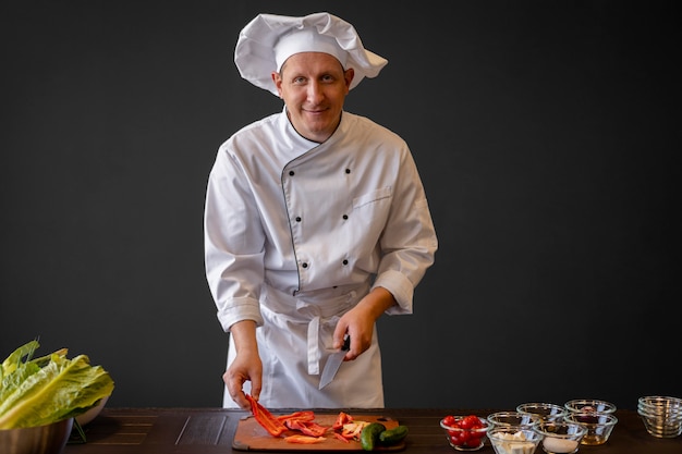 Medium shot chef cutting vegetables