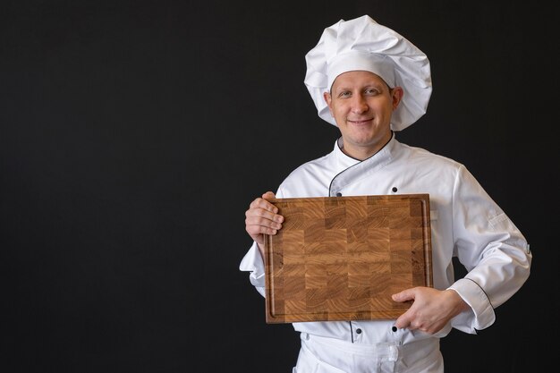 Free photo medium shot chef holding board