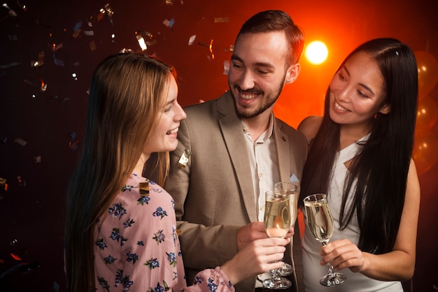 Medium shot of colleagues toasting at party