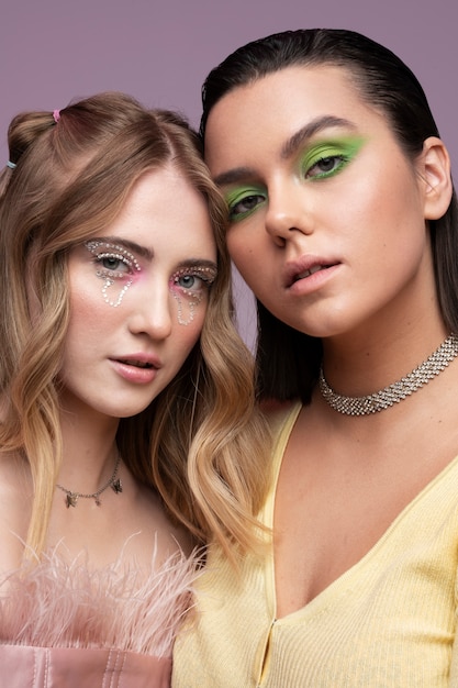 Free photo medium shot cool girls with gen z makeup