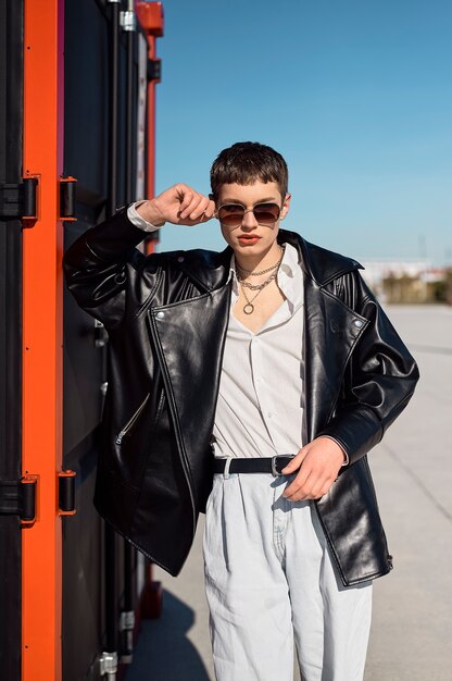 Medium shot cool man with sunglasses outdoors