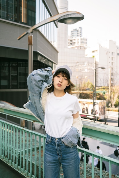 Free photo medium shot cool woman wearing trucker hat