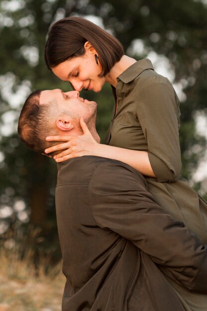 Medium shot couple being romantic