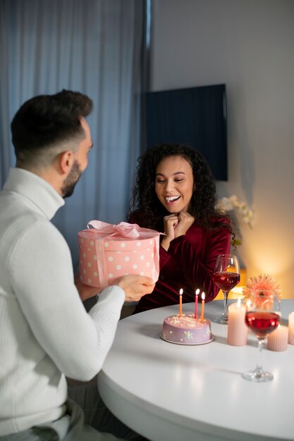 Medium shot couple celebrating birthday