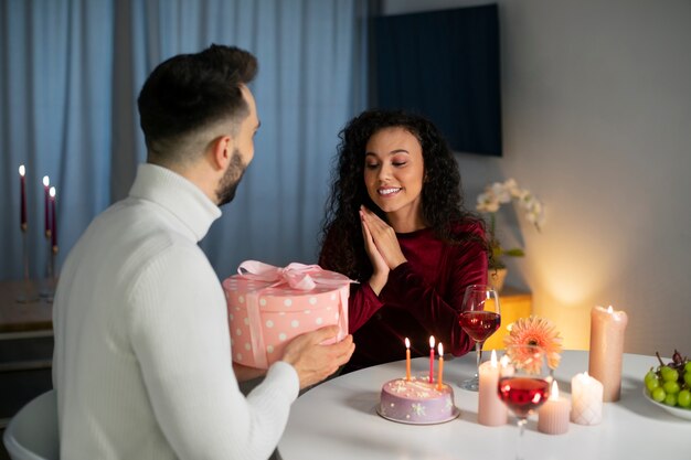 Medium shot couple celebrating birthday