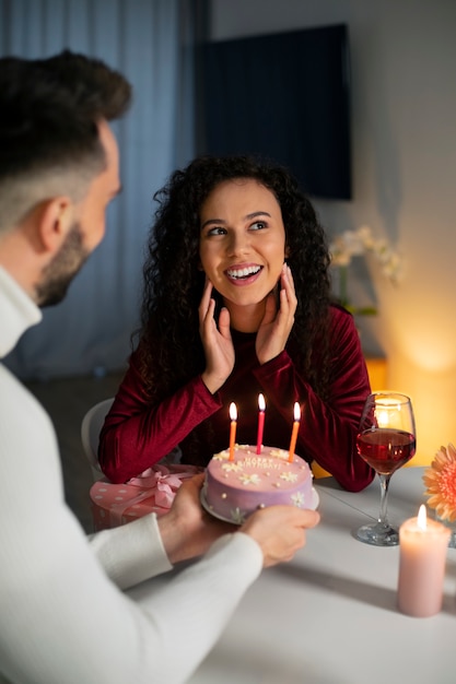 Medium shot couple celebrating birthday