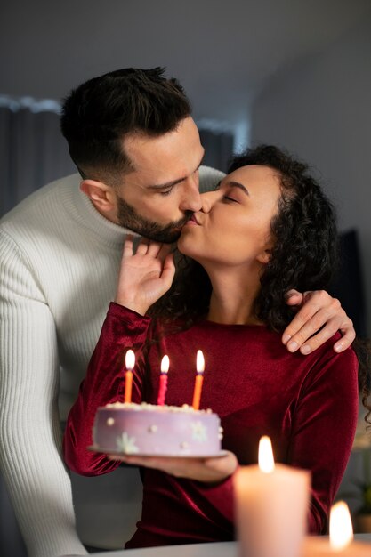 Medium shot couple celebrating birthday