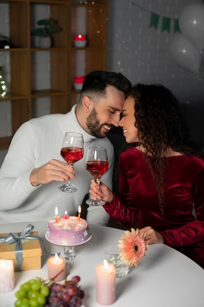 Free photo medium shot couple celebrating birthday