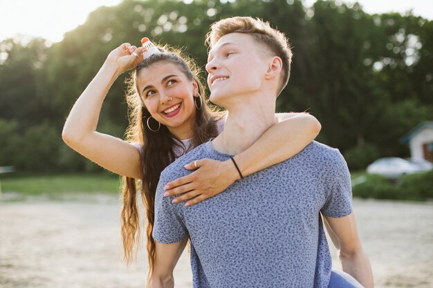 Medium shot couple fooling around together