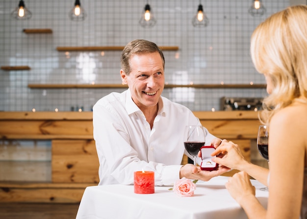 Free photo medium shot of couple getting engaged