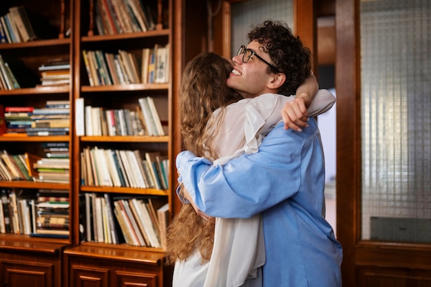 Medium shot couple having a bookstore date