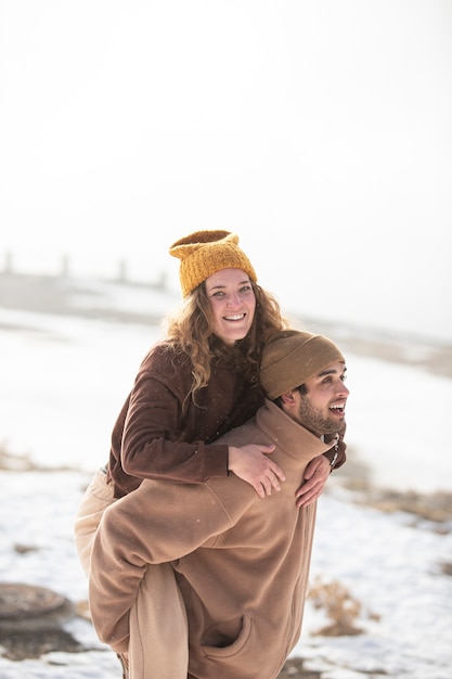 Free photo medium shot couple having fun in nature