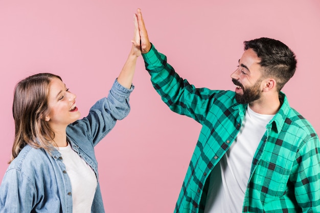 Medium shot couple high fiving