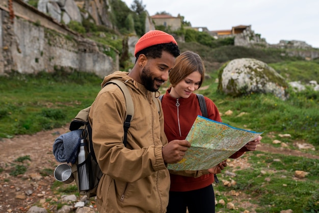 Free photo medium shot couple hiking together