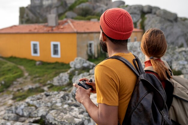 Medium shot couple hiking together