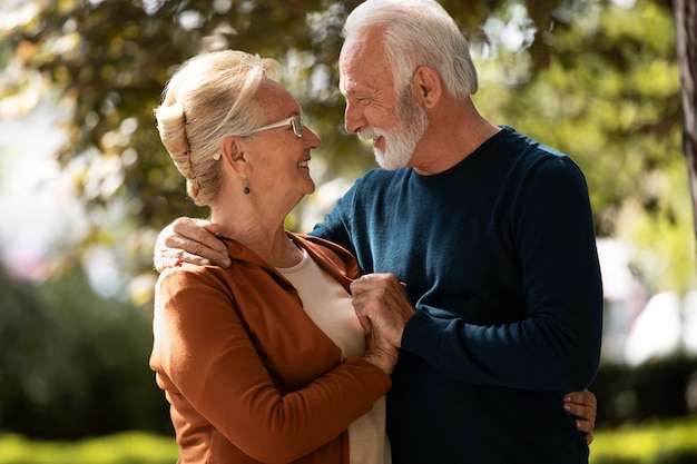 Medium shot couple holding each other