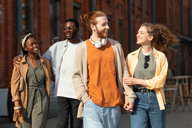 Medium shot couple holding hands outdoors