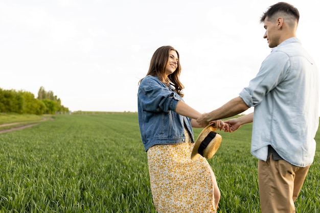 Medium shot couple holding hands