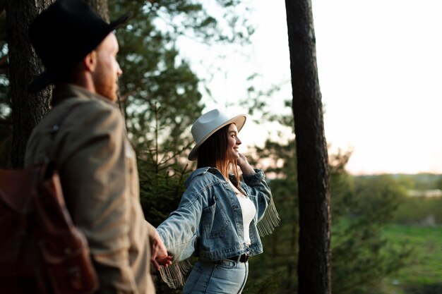 Medium shot couple holding hands