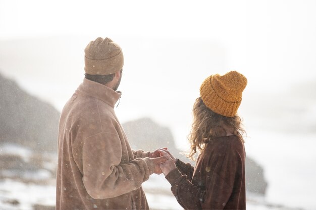 Medium shot couple holding hands