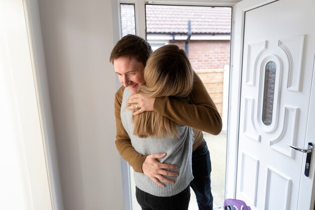 Medium shot couple hugging