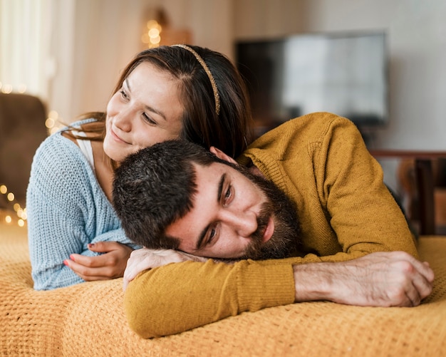 Free photo medium shot couple laying together