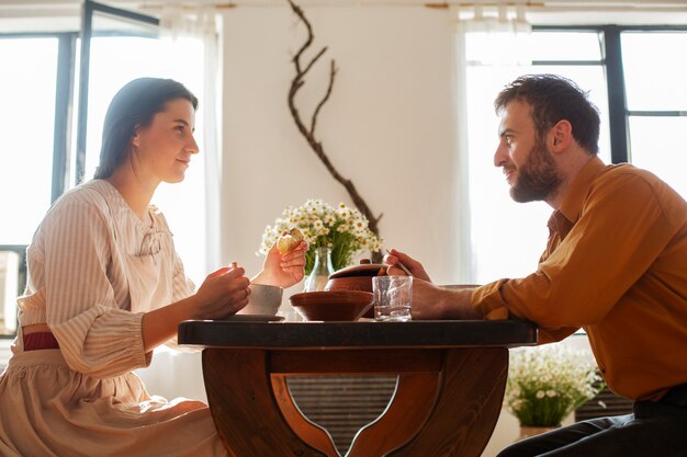 Medium shot couple living at farmhouse