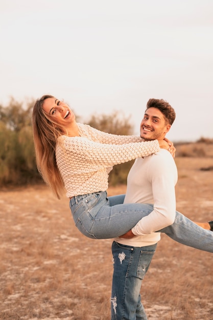 Medium shot of couple looking at camera