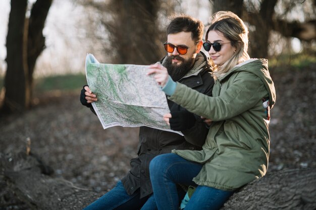 Medium shot couple looking at map