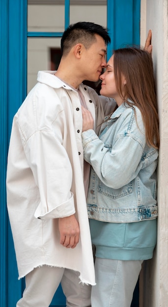 Medium shot couple near wall