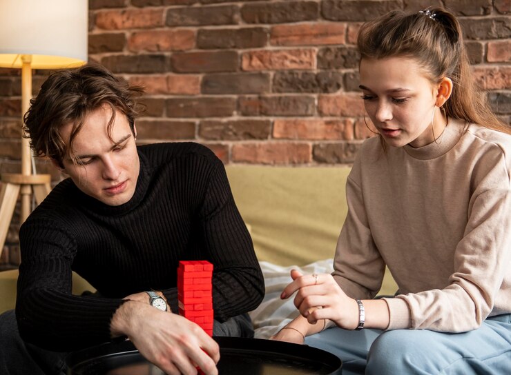 Medium shot couple playing game