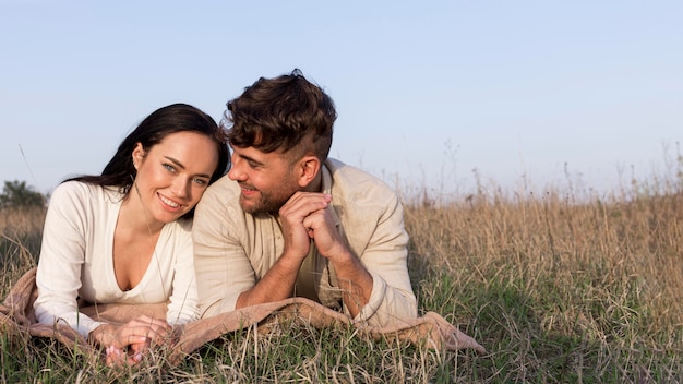 Free photo medium shot couple posing together