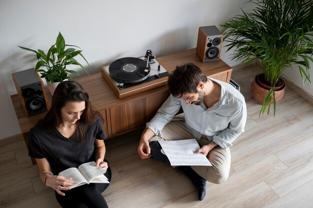 Medium shot couple reading together