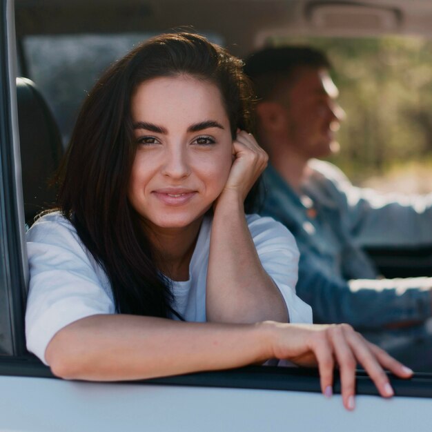 Medium shot couple on road trip