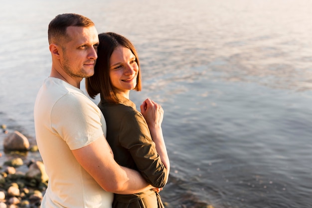 Medium shot couple at seaside