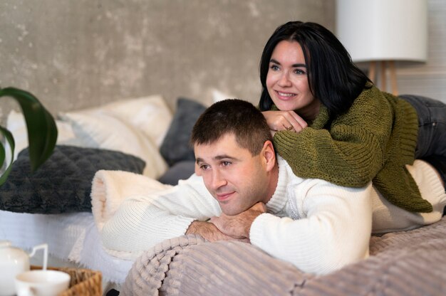 Medium shot couple sitting together