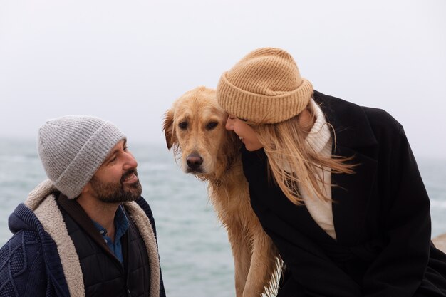 Medium shot couple spending time at seaside