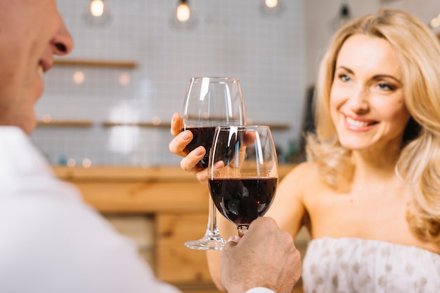 Medium shot of couple toasting