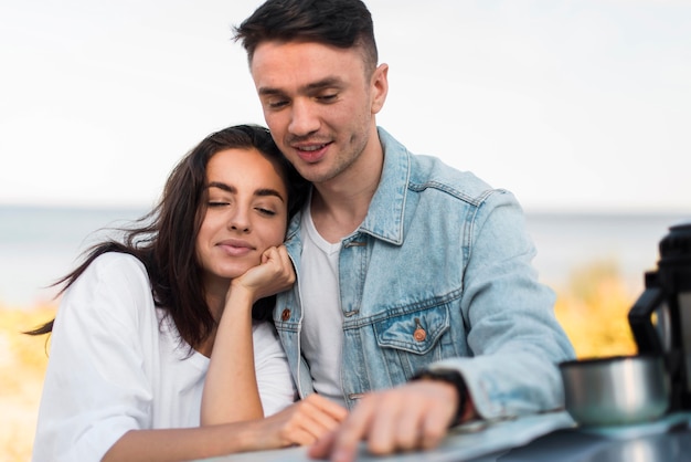 Free photo medium shot couple touching map