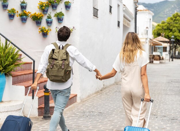 Medium shot couple with baggage