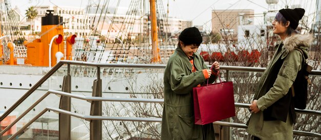 Medium shot couple with shopping bag