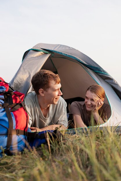 Medium shot couple with tent