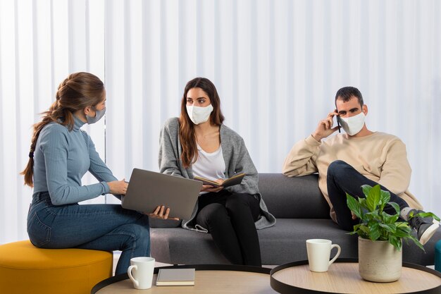 medium shot coworkers on couch