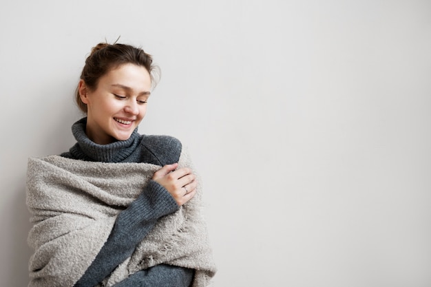 Medium shot cozy woman at home