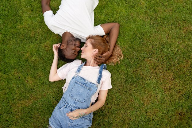 Medium shot cute couple on grass