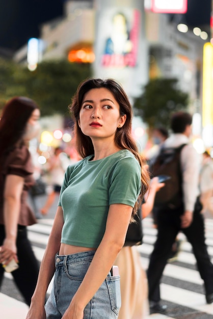 Free photo medium shot of cute girl in tokyo