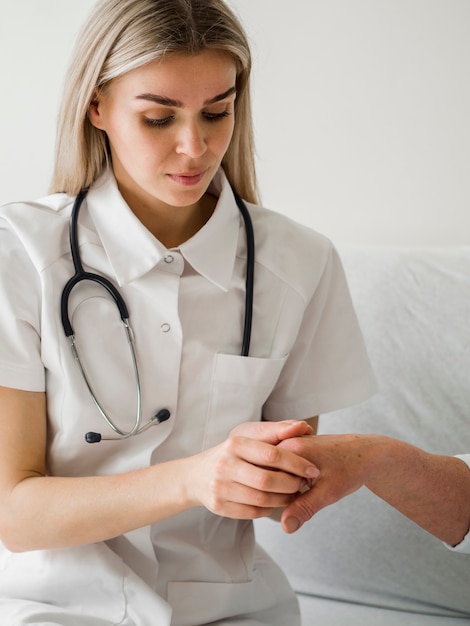 medium shot doctor checking patient