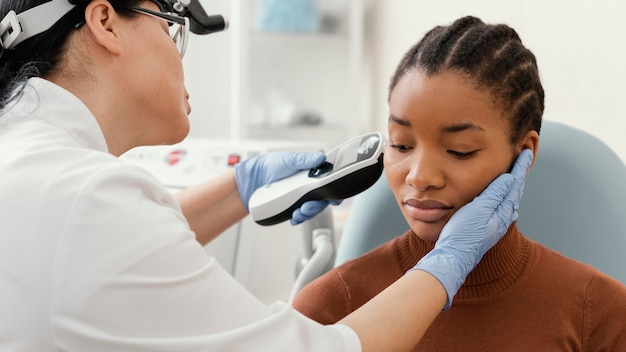 Medium shot doctor checking patient