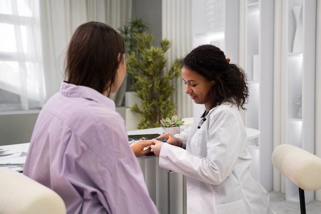 Medium shot doctor checking patient