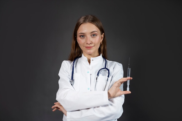 Free photo medium shot doctor holding syringe